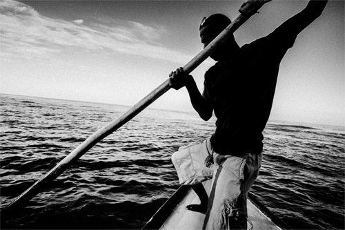 Original street photograph of a boatman
